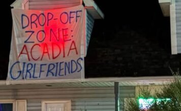 Homecoming sign sparks calls for education, accountability